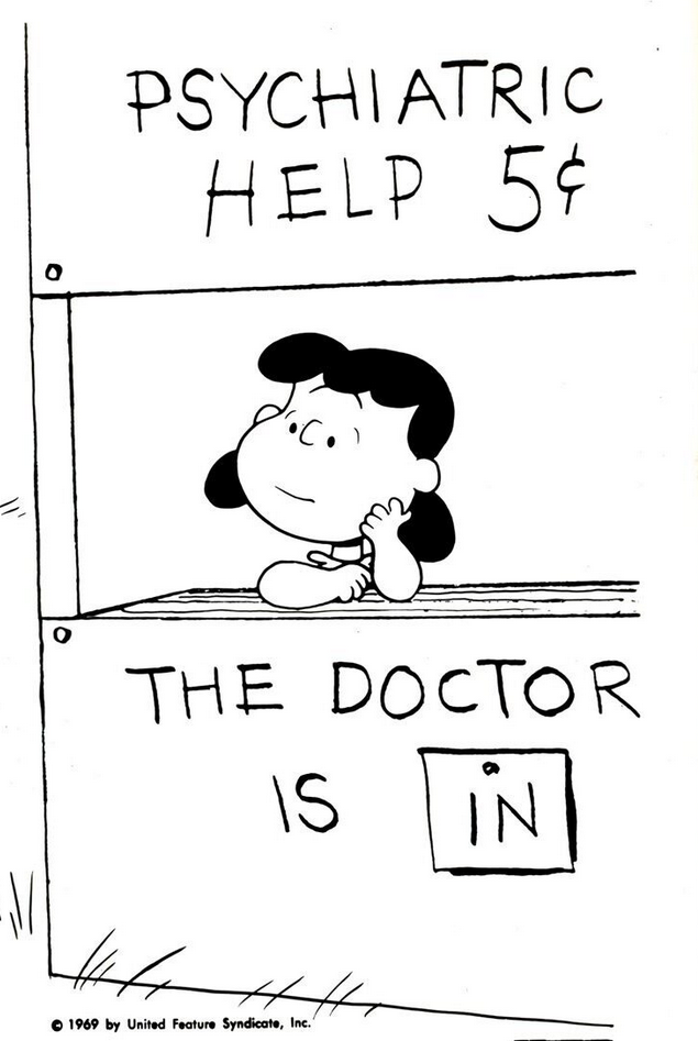 Lucy from Peanuts at her desk