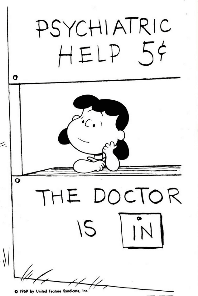 Lucy from Peanuts at her desk